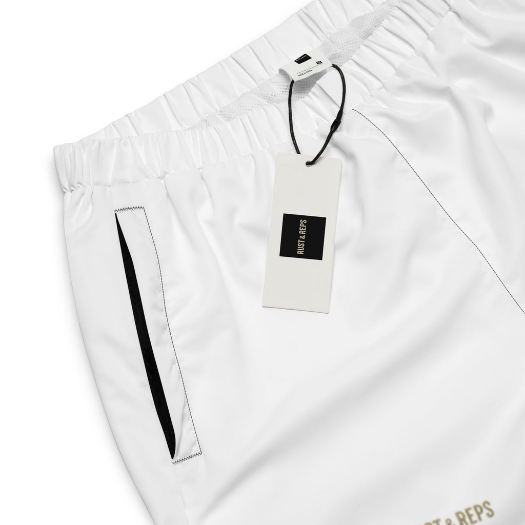 The Track Pants – front view, white, product label – rustNreps